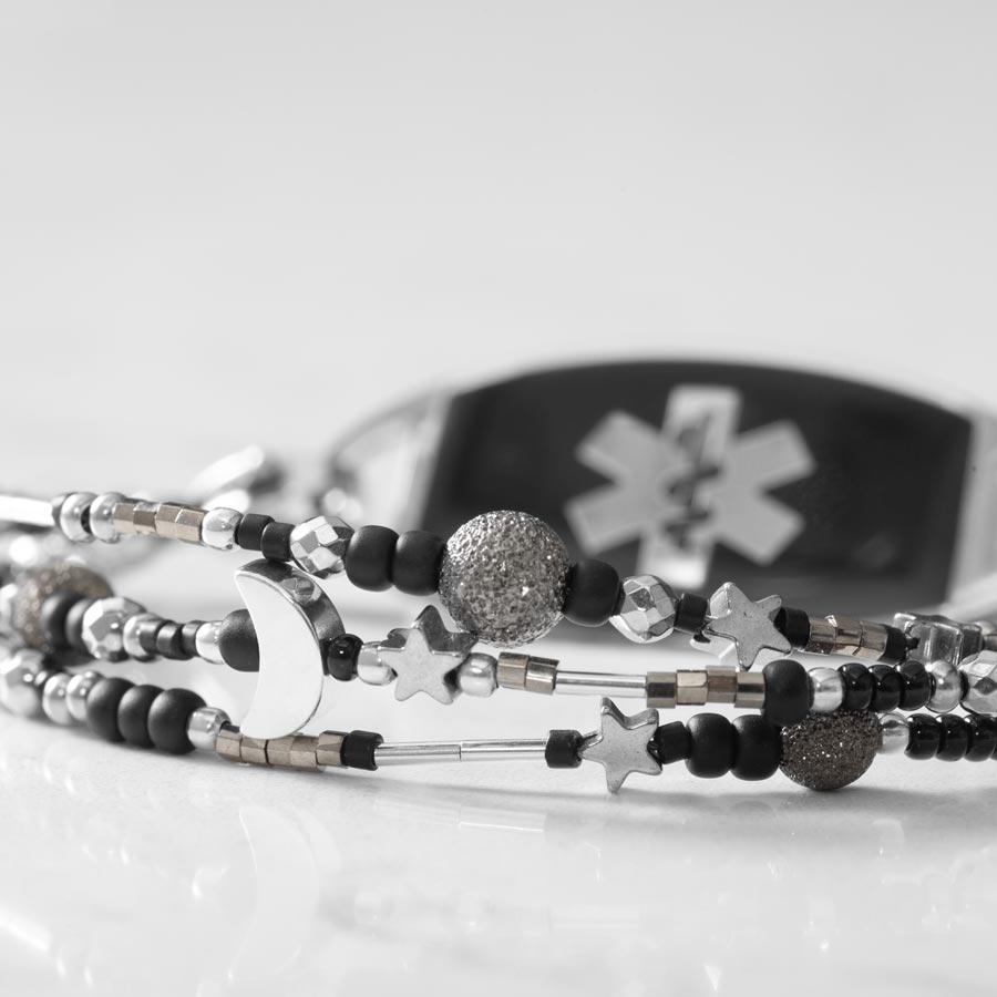 Close up image of black and silver beaded multi-strand medical ID bracelet paired with stainless steel medical ID tag with black inlay