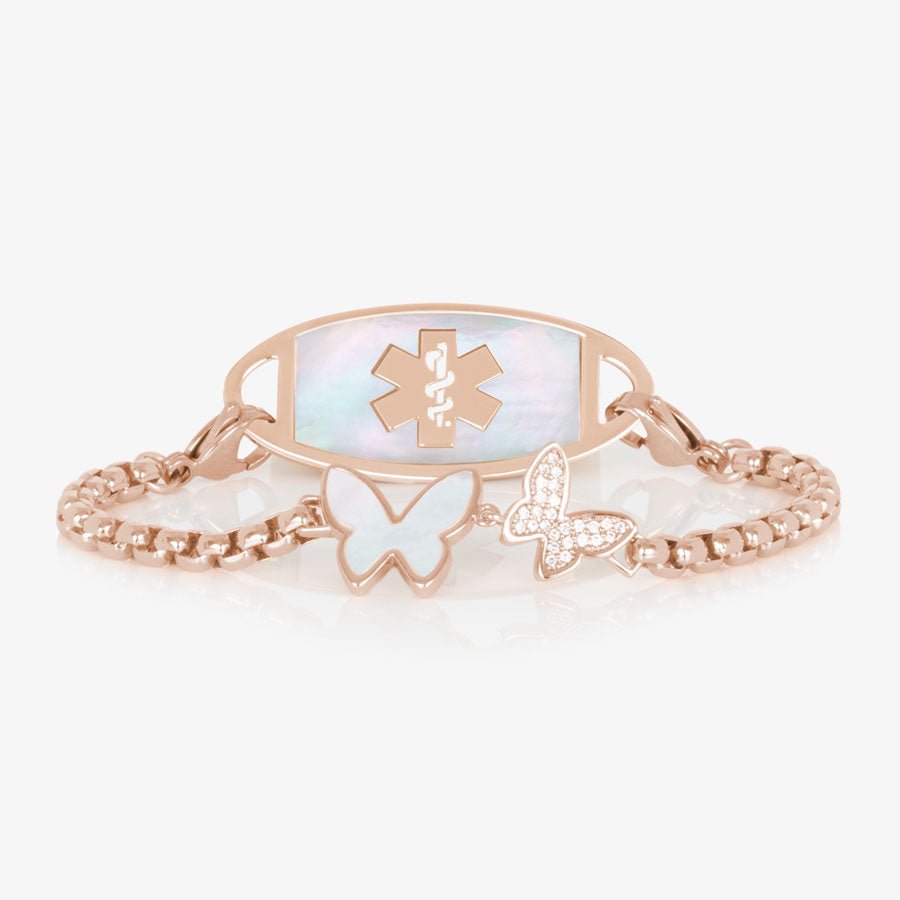 Rose gold tone box chain featuring a double butterfly centerpiece, inlaid with Mother of Pearl and cubic zirconia crystals. Attached to a rose gold toned medical ID tag with inlaid mother of pearl