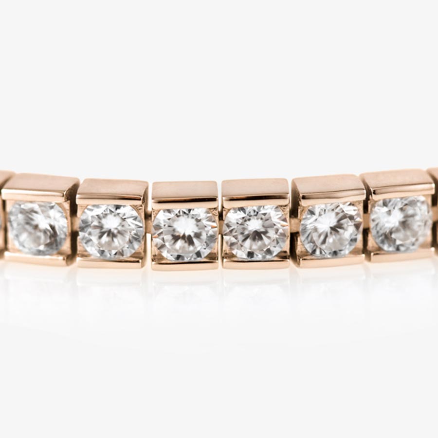 Detail photo of rose gold tone medical ID tennis bracelet with pave set cubic zirconia crystals.