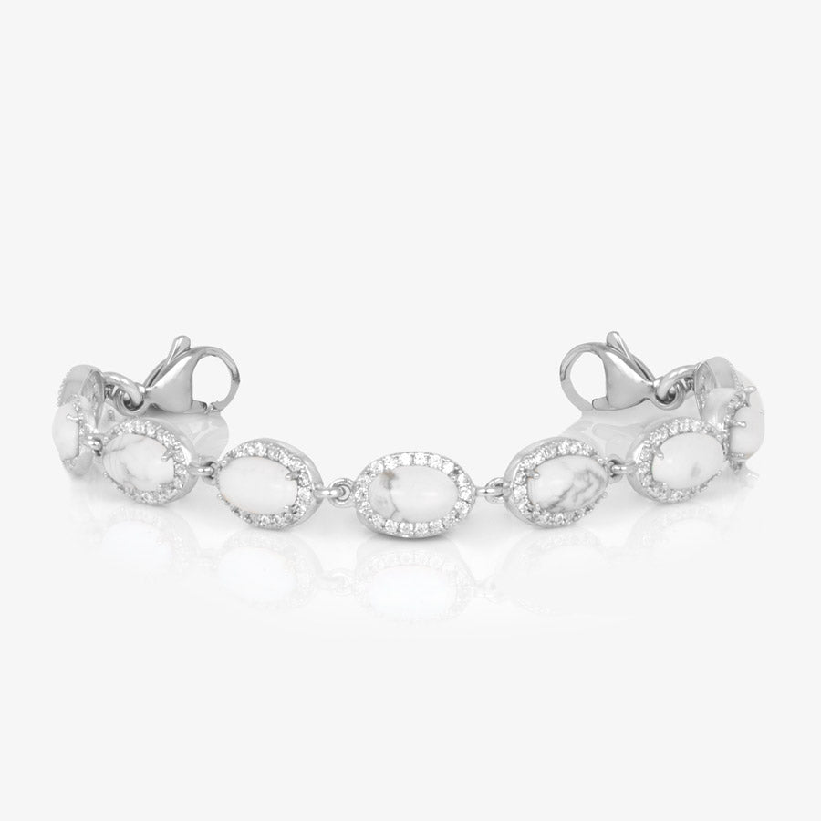 Oval-shaped howlite, cubic zirconia, with silver-dipped lobster clasps on each end