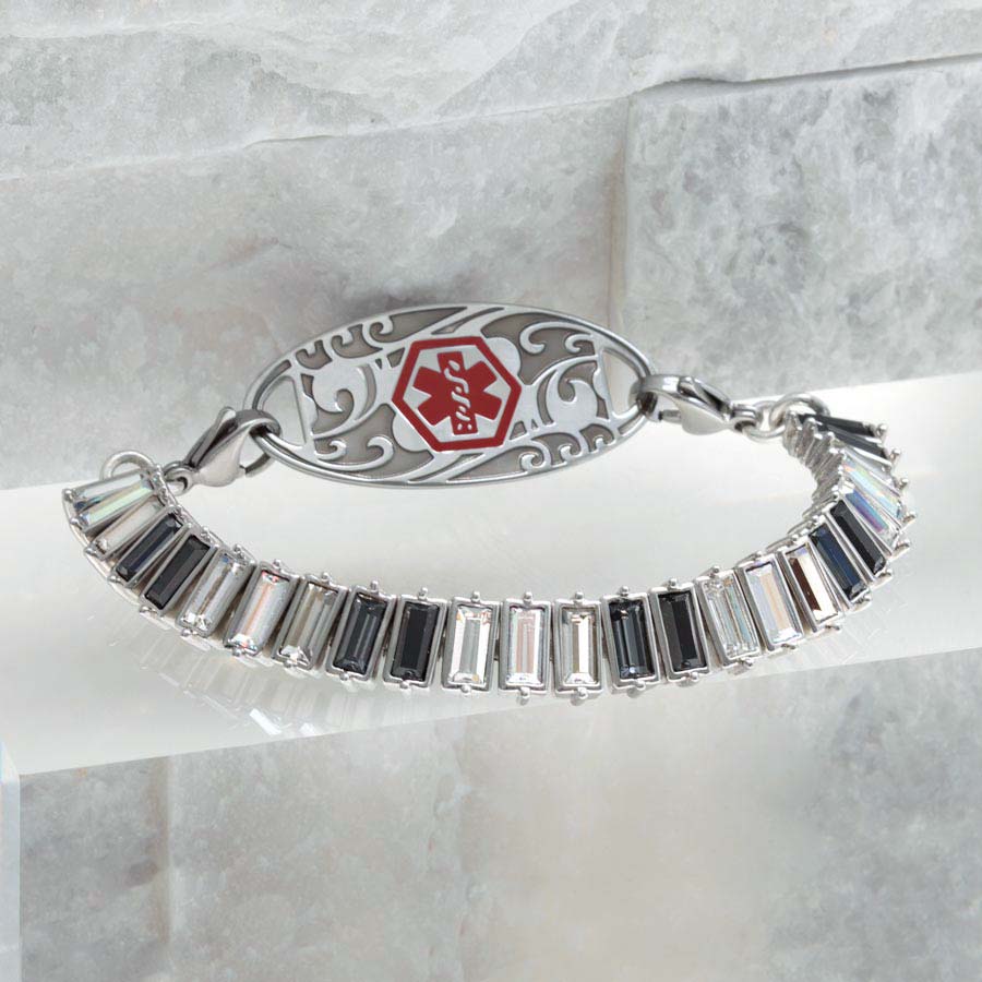 Silver tone medical ID tennis bracelet with black, gray, and clear crystals and decorative stainless steel medical ID tag with red symbol.