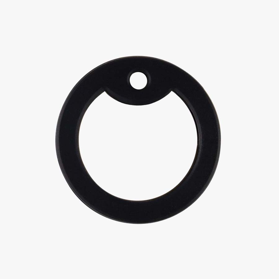 Black silicone piece that fits around the outer border of an aluminum dog tag for comfort.