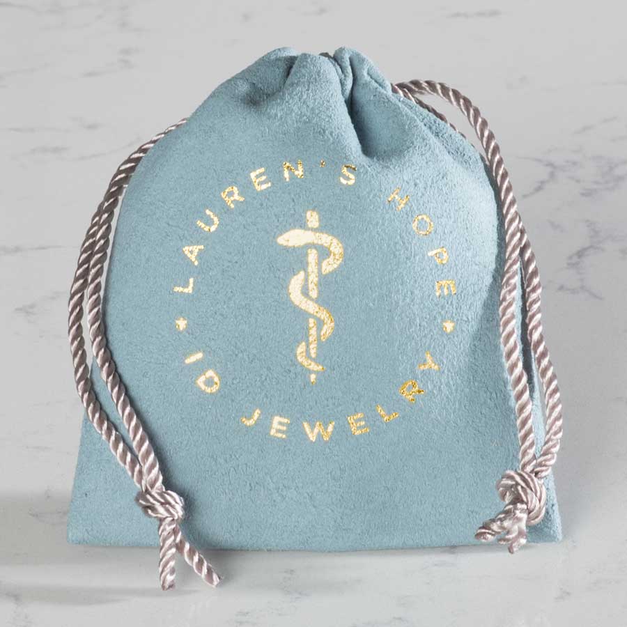 Blue Suede Drawstring closure bag with Gold Foil imprint of Lauren&#39;s Hope Med ID Jewelry and logo