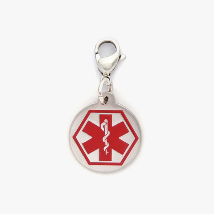 Small circular silver tone charm with large red medical caduceus symbol hanging on a matching lobster clasp