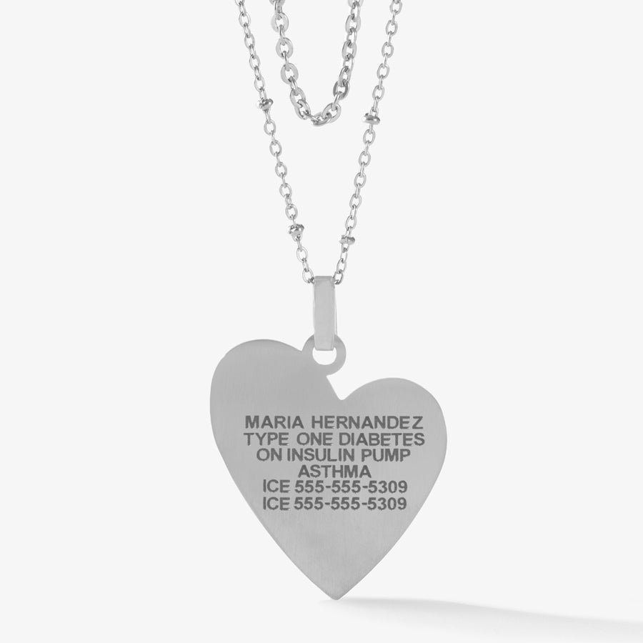 Silver heart pendant necklace with premium laser engraving on layered necklace strands.