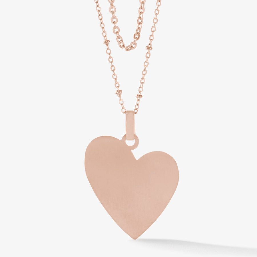 Back side of rose gold tone heart pendant necklace.