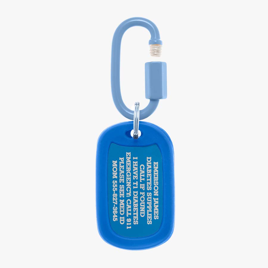 Royal blue aluminum bag tag with engraving example and coordinating silicone silencer on matching carabiner clip.